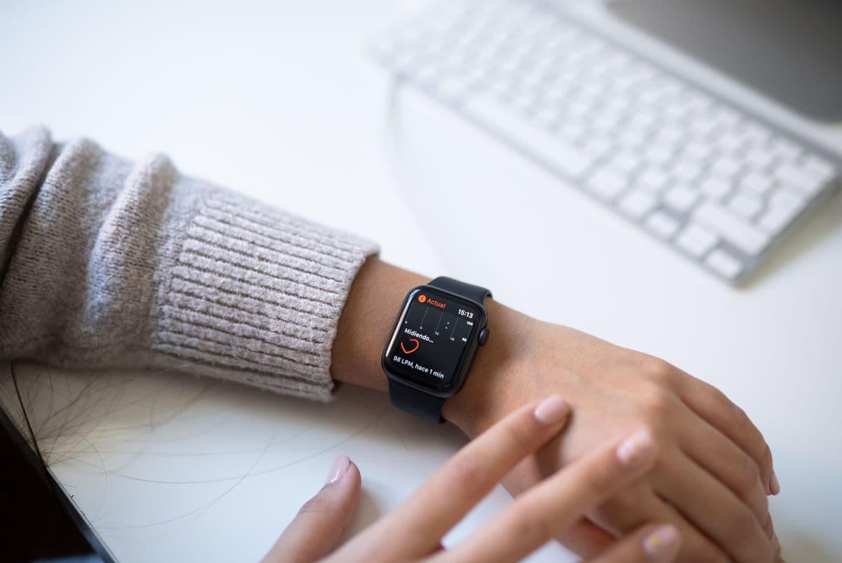 A wearable device displaying a live heart-rate reading